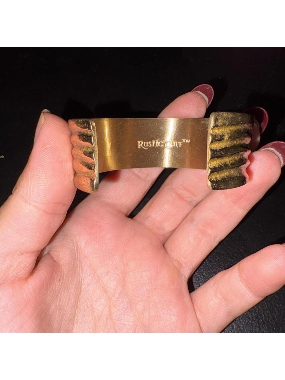 Vintage Rustic cuff bracelet with gold-colored metal and textured ridges
